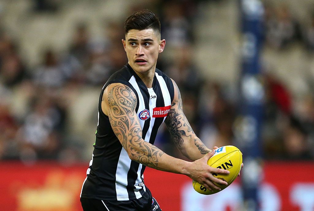 MELBOURNE, AUSTRALIA - JUNE 24: Marley Williams of the Magpies runs with the ball during the round 14 AFL match between the Collingwood Magpies and the Fremantle Dockers at Melbourne Cricket Ground on June 24, 2016 in Melbourne, Australia. (Photo by Scott Barbour/Getty Images)